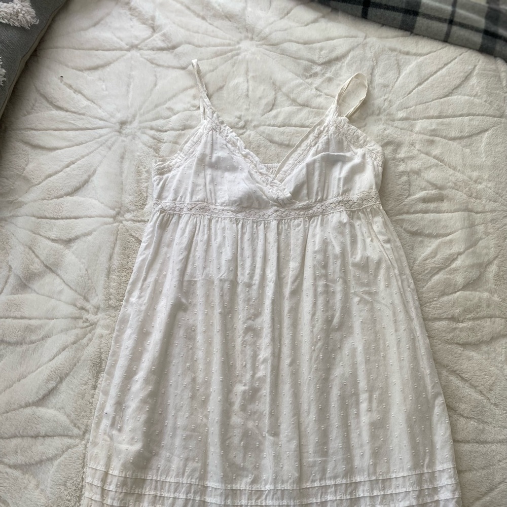 Very pretty white dress with beautiful detailing!